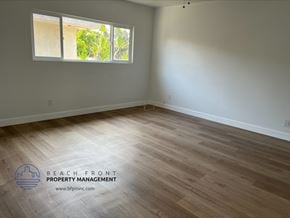 Gardena apartment for rent - the living room of a house with wooden floors and a window